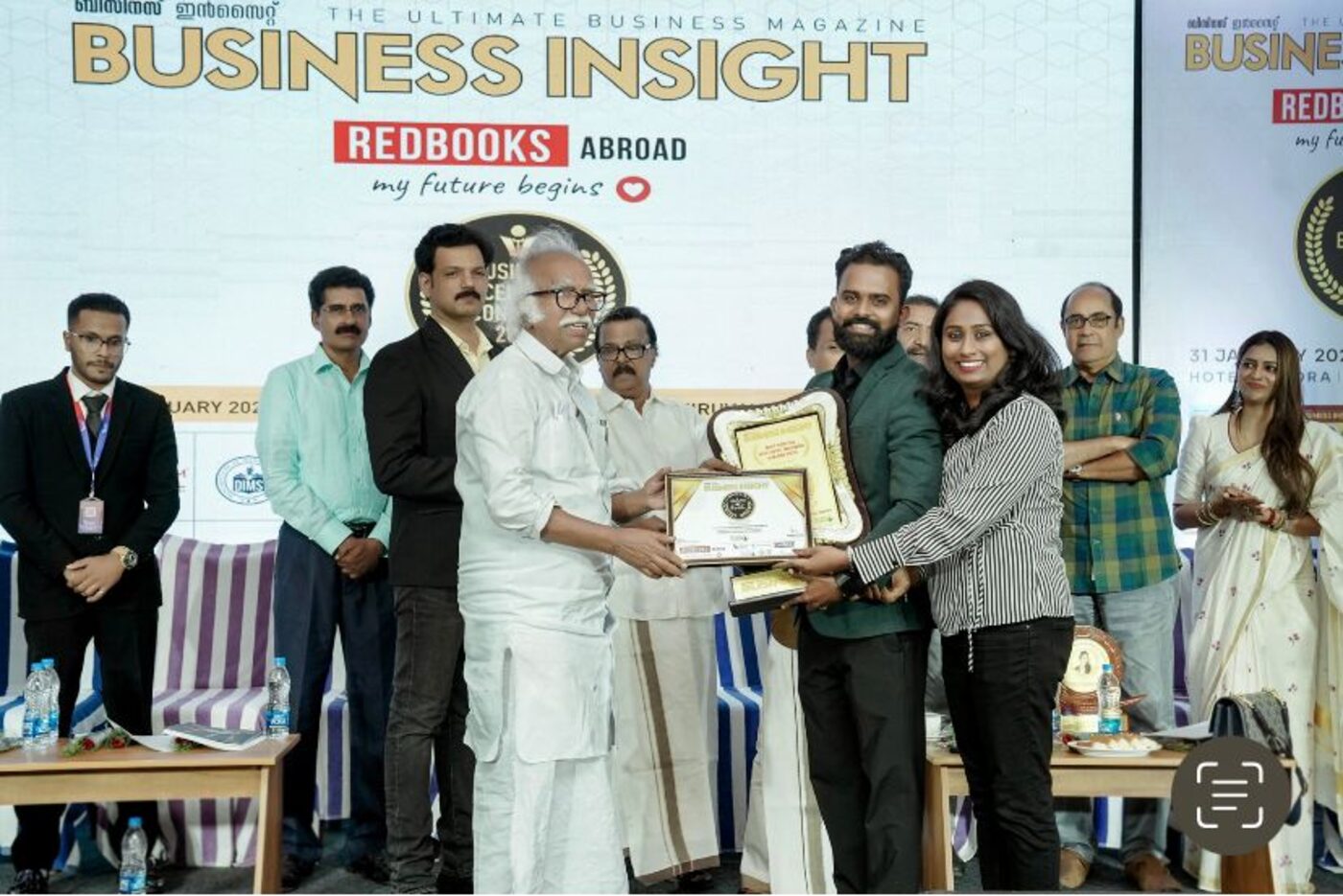 Vishnu Chakrapani and Sajitha Vishnu receiving an award